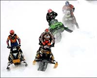 Professional snowmobilers prepare for the X Games in Aspen, Colo., in January 2007. Five people riding snowmobiles were killed in avalanches at the weekend in the western US states of Utah, Montana and Idaho. Photo courtesy AFP.