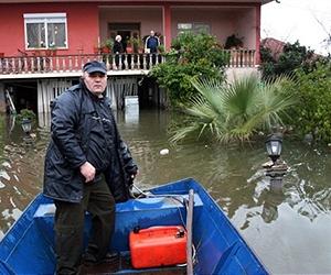 Surrounded by floodwaters, Albanians refuse to leave home