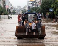 Dozens killed as south China hit by floods and rainstorms