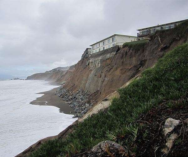 France destroys seaside flats threatened by coastal erosion
