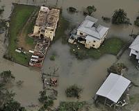 Australia floodwaters still rising, police search for missing