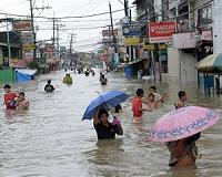 One dead as tropical storm flooding paralyses Philippine capital