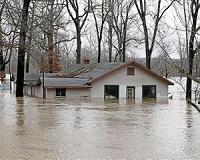 US towns at risk as levees fail amid rare winter floods