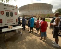 New Orleans revives as storm-slammed suburbs struggle