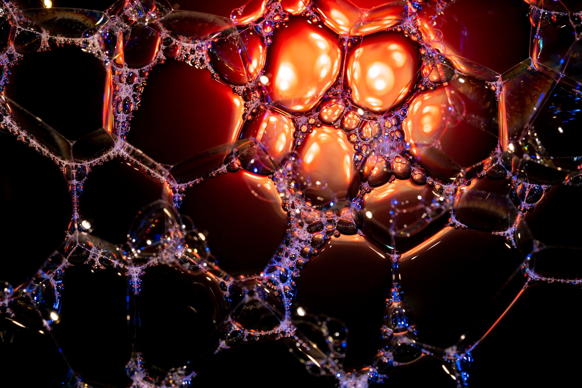 Vibrant close-up of soap bubbles with stunning light play in Valencia, Spain.